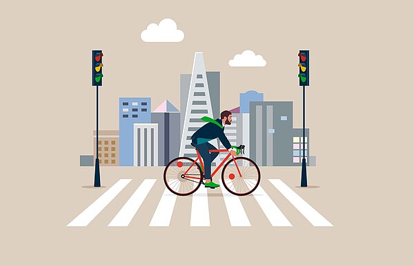 Die Illustration eines Radfahrers, der über eine Ampel in einer Stadt fährt.